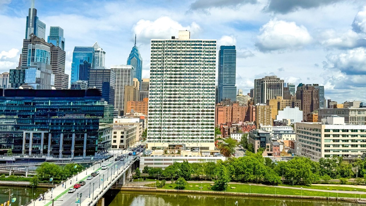 Looking east towards the office buildings of Center City, seen from West Philadelphia's Cira Green, Philadelphia, Pennsylvania, USA - June 10, 2025.  Cera Green is an urban green space featuring grassy spots, skyline vistas, a burger joint & outdoor activities.